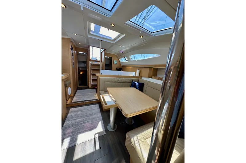 Slide: The Image of Interior of 2018 Elan 45 Impressions yacht with modern seating and skylights. - 76