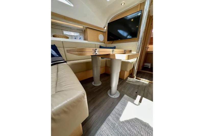 Slide: The Image of Interior of 2018 Elan 45 Impressions yacht with modern seating and table. - 85
