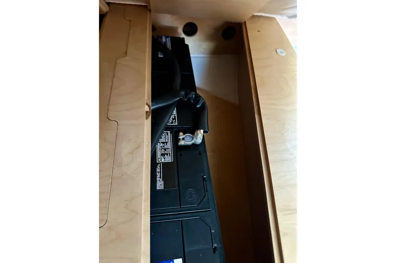 Slide: The Image of Battery compartment in 2018 Elan 45 Impressions yacht, featuring wooden paneling. - 87