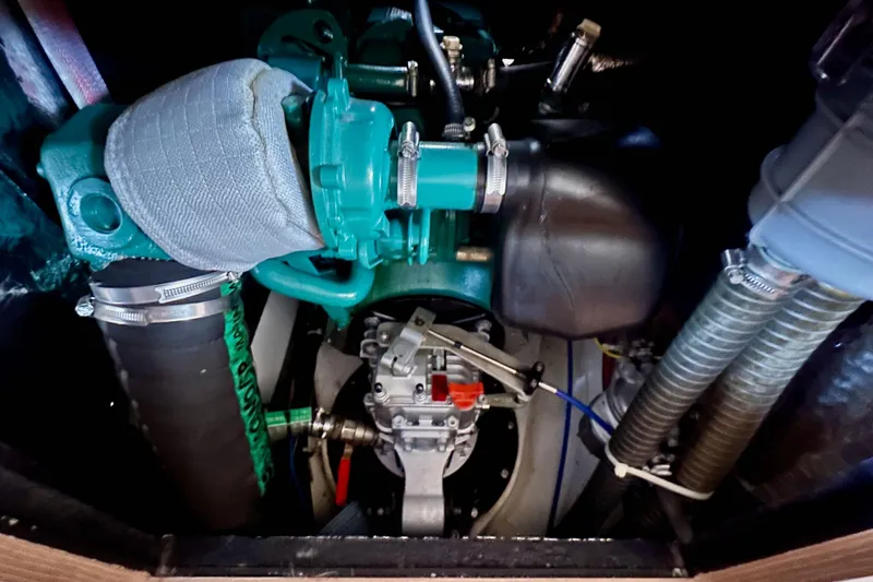 Slide: The Image of Engine compartment of 2018 Elan 45 Impressions yacht, showcasing mechanical components and hoses. - 88