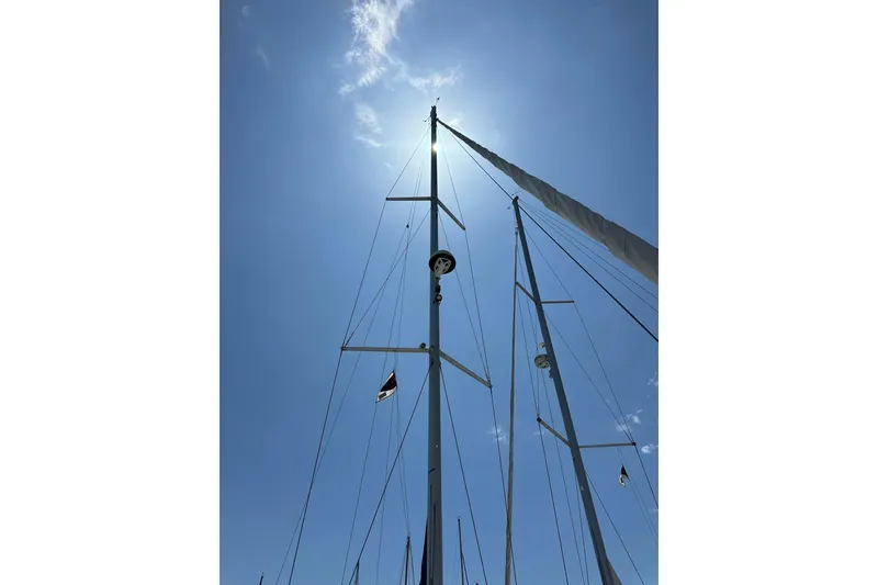Slide: The Image of Sailboat mast of 2018 Elan 45 Impressions against a bright blue sky. - 9