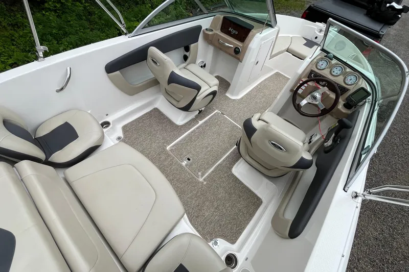 Slide: The Image of 2014 Chaparral 18 H2O Ski & Fish boat interior with seating and dashboard. - 13