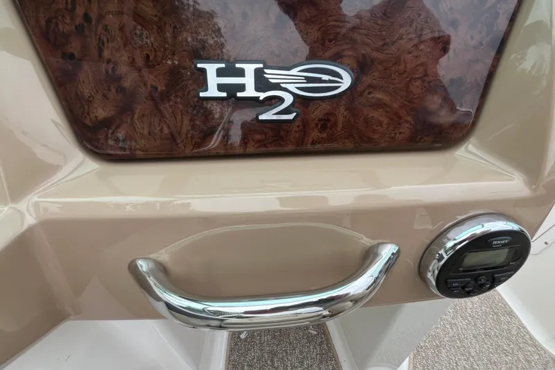 Slide: The Image of 2014 Chaparral 18 H2O Ski & Fish dashboard with H2O logo and control panel. - 16