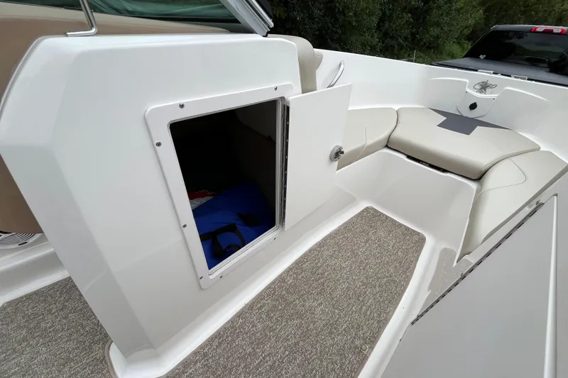 Slide: The Image of 2014 Chaparral 18 H2O Ski & Fish boat interior with open storage compartment. - 22