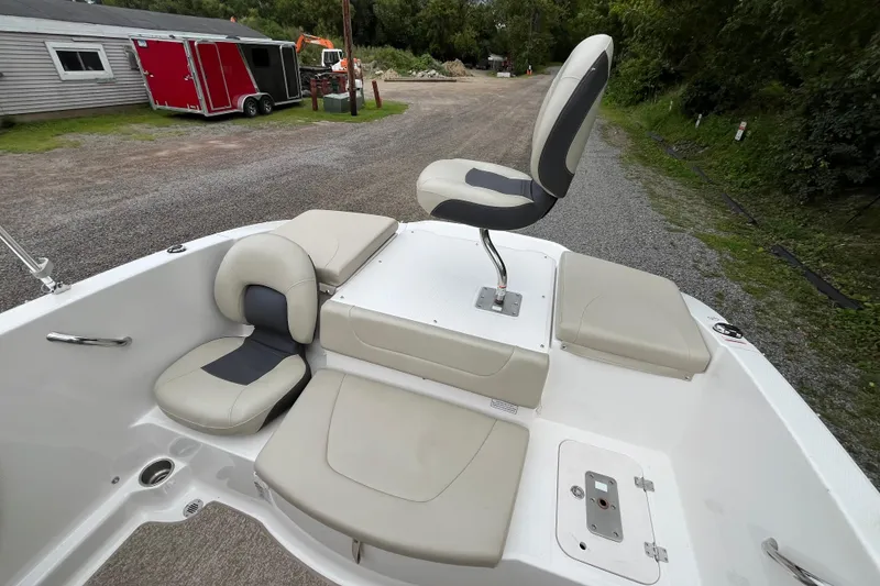 Slide: The Image of 2014 Chaparral 18 H2O Ski & Fish boat interior with seating and storage compartments. - 26