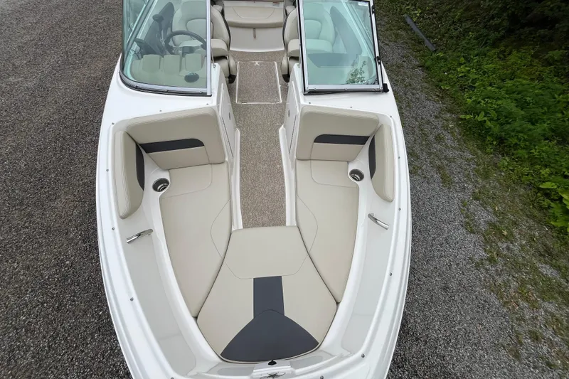 Slide: The Image of 2014 Chaparral 18 H2O Ski & Fish boat interior with beige seating and open bow design. - 27
