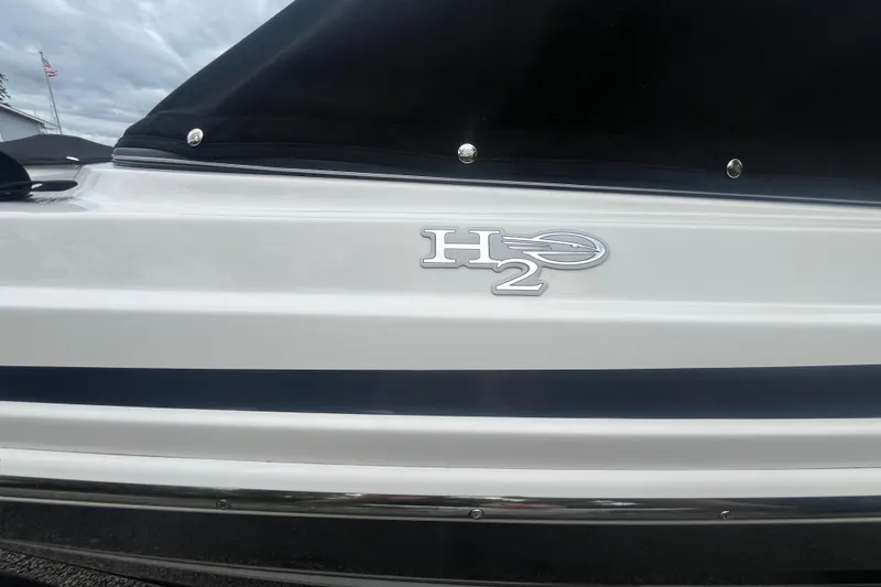 Slide: The Image of 2014 Chaparral 18 H2O Ski & Fish boat with H2O emblem on white hull. - 3