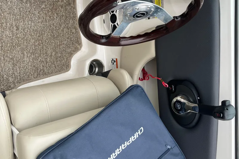 Slide: The Image of 2014 Chaparral 18 H2O Ski & Fish boat interior with steering wheel and throttle. - 32