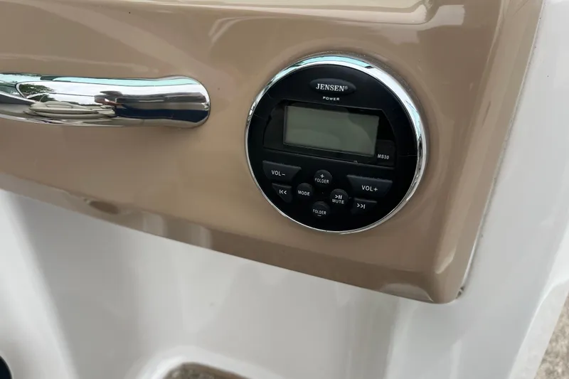 Slide: The Image of Jensen stereo system on 2014 Chaparral 18 H2O Ski & Fish boat dashboard. - 34