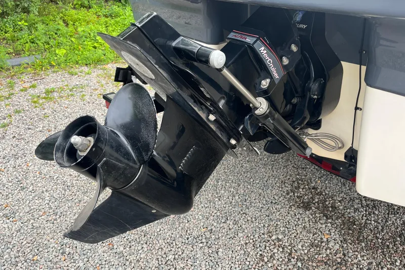 Slide: The Image of 2014 Chaparral 18 H2O Ski & Fish boat's MerCruiser outdrive on gravel surface. - 36