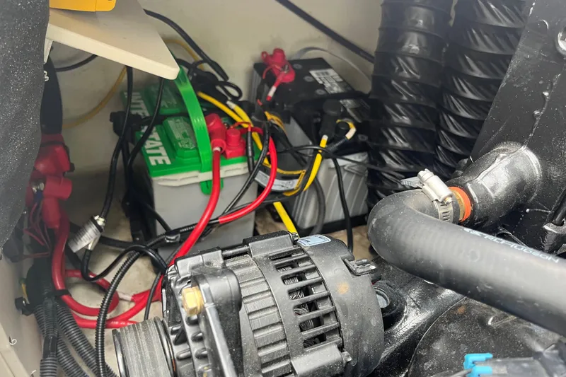 Slide: The Image of Engine compartment of a 2014 Chaparral 18 H2O Ski & Fish boat with visible battery and wiring. - 5