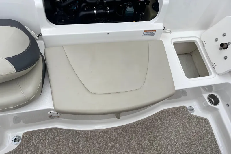 Slide: The Image of 2014 Chaparral 18 H2O Ski & Fish boat interior with seating and storage compartments. - 7