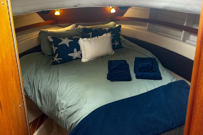 Slide: The Image of Cozy cabin interior of 2015 Ranger Tugs R-31 S with starfish-themed bedding. - 3