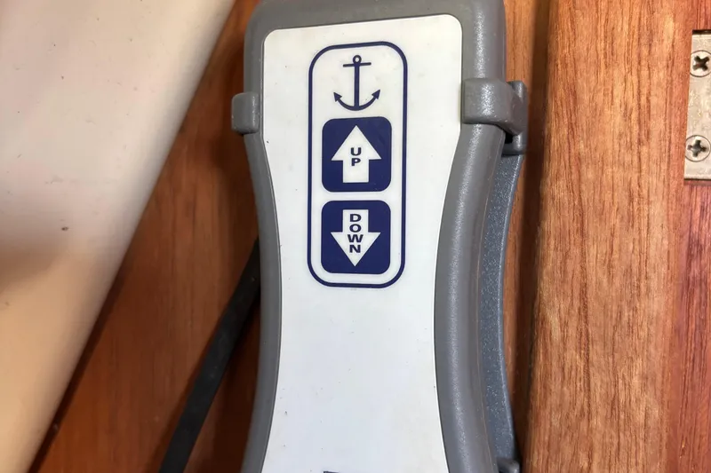 Slide: The Image of Anchor control panel on 1981 O'Day 34 sailboat, featuring up and down buttons. - 19