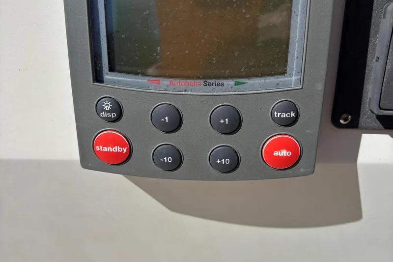 Slide: The Image of Autopilot control panel on a 1981 O'Day 34 sailboat, featuring various function buttons. - 24