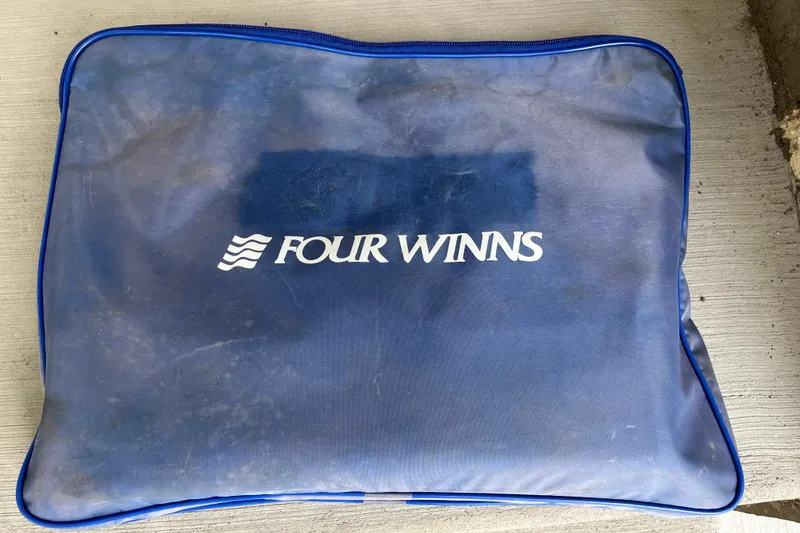 Slide: The Image of Blue Four Winns bag on concrete, featuring white logo. - 26