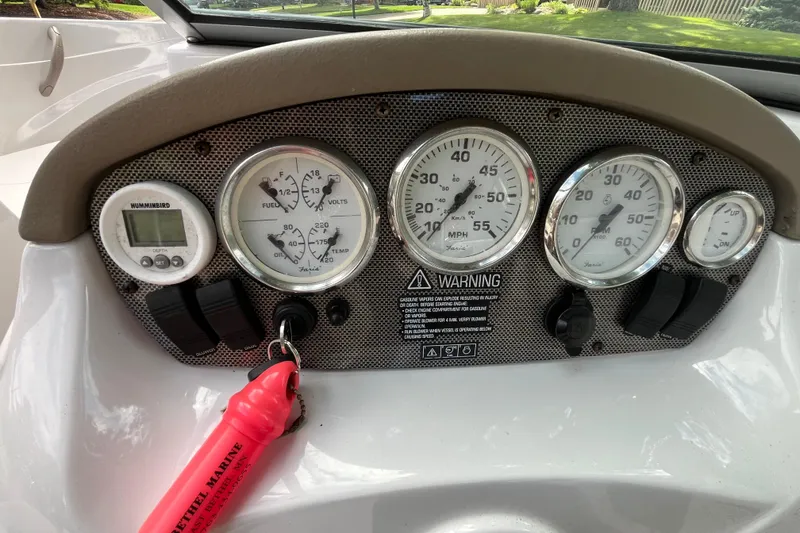Slide: The Image of Dashboard of 2008 Four Winns H180 boat with gauges and controls. - 9