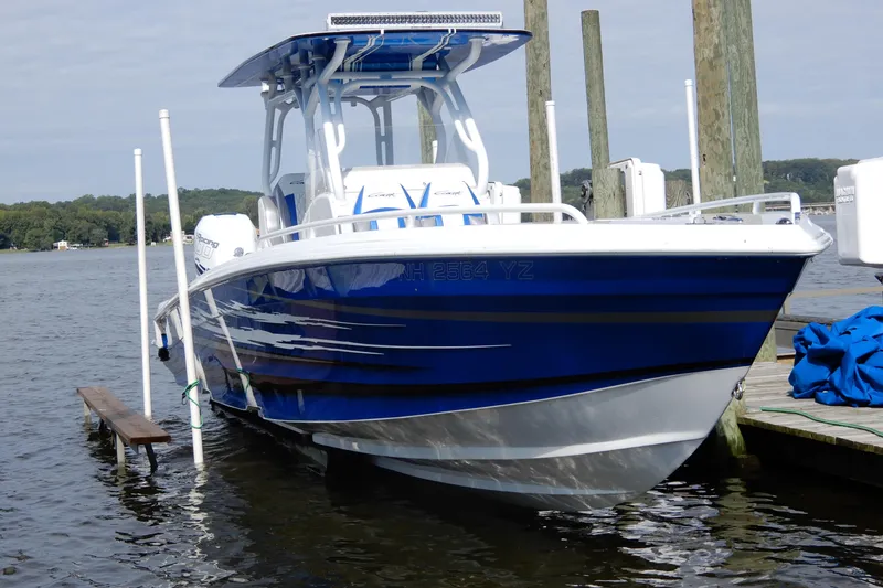 Slide: The Image of Blue 2021 Concept 32' Open Deck boat docked on calm water. - 1