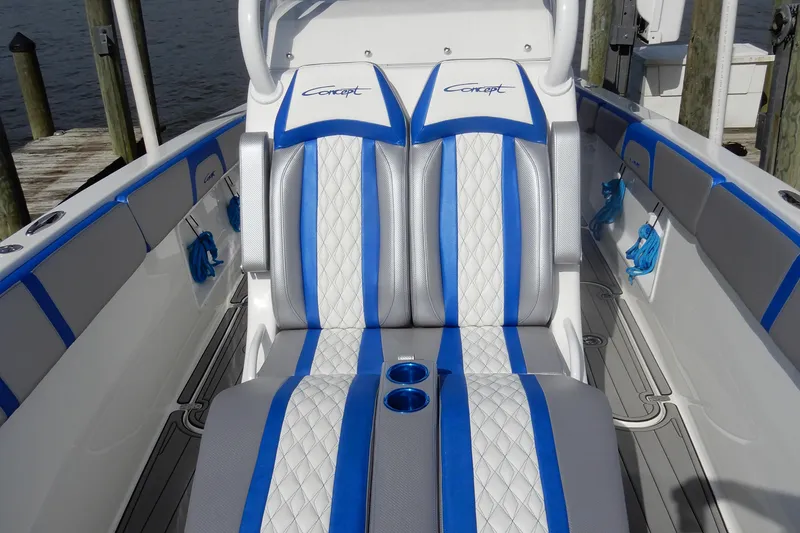 Slide: The Image of Luxury seating on 2021 Concept 32' Open Deck boat with blue and white upholstery. - 10