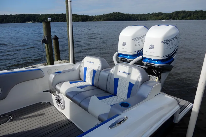 Slide: The Image of 2021 Concept 32' Open Deck boat with twin Racing 400 engines on a serene lake. - 14