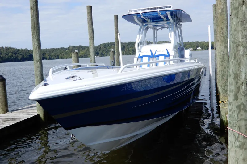 Slide: The Image of 2021 Concept 32' Open Deck boat docked on a serene lake. - 2
