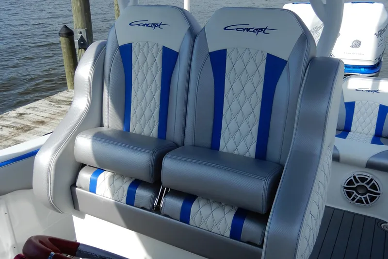 Slide: The Image of Luxury seating on 2021 Concept 32' Open Deck boat, featuring blue and white upholstery. - 20