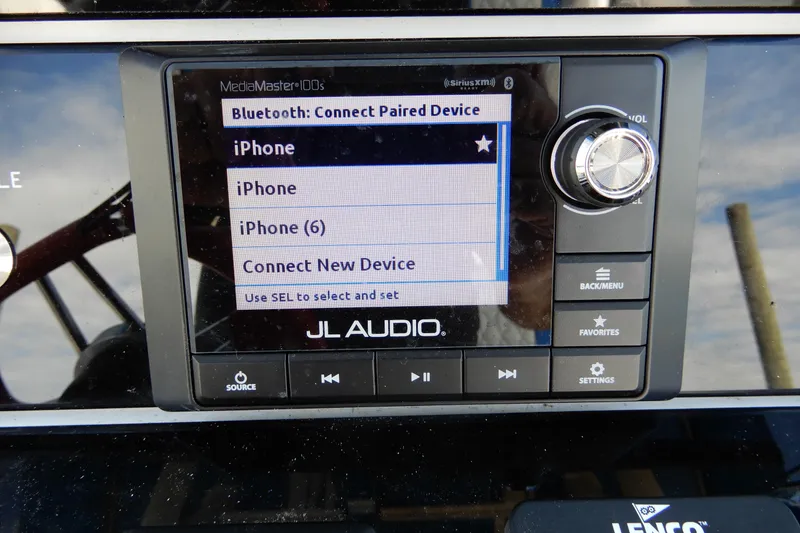Slide: The Image of JL Audio Bluetooth interface on Concept 32' Open Deck, 2021 model, displaying paired devices. - 24