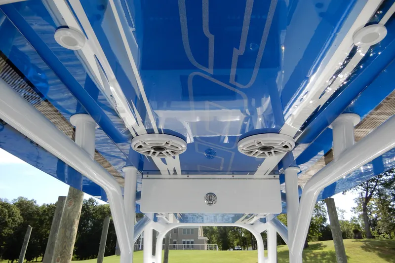 Slide: The Image of Blue and white underside of 2021 Concept 32' Open Deck boat with speakers. - 26
