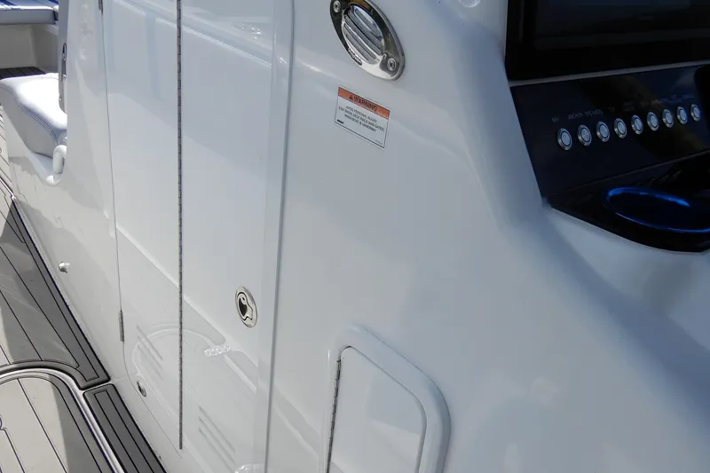 Slide: The Image of 2021 Concept 32' Open Deck boat interior with control panel and seating. - 32