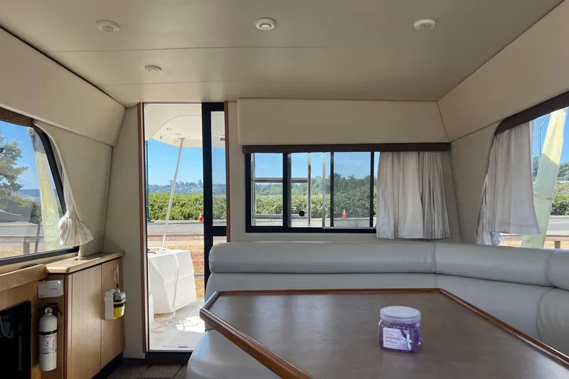 Slide: The Image of Interior of 2000 Bayliner 3388 Command Bridge Motoryacht with seating and table. - 10