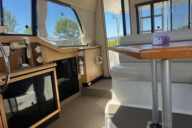 Slide: The Image of Interior of 2000 Bayliner 3388 Command Bridge Motoryacht with seating and navigation instruments. - 11