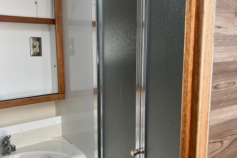 Slide: The Image of Bathroom interior of 2000 Bayliner 3388 Command Bridge Motoryacht with shower and sink. - 13