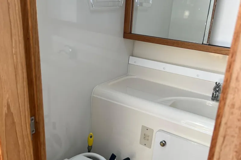 Slide: The Image of Bathroom interior of 2000 Bayliner 3388 Command Bridge Motoryacht with sink and mirror. - 14