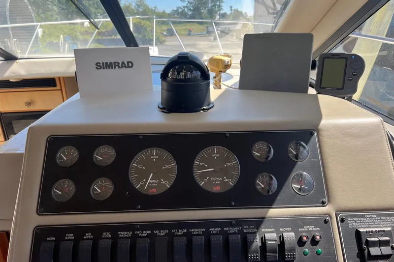 Slide: The Image of Control panel of 2000 Bayliner 3388 Command Bridge Motoryacht with Simrad equipment. - 20