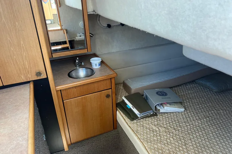 Slide: The Image of Interior of 2000 Bayliner 3388 Command Bridge Motoryacht with sink and bed. - 21