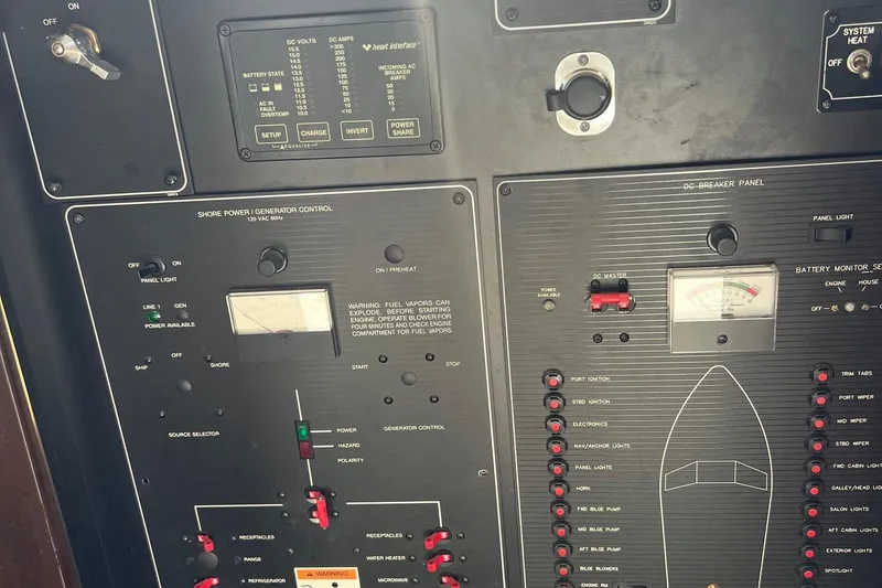Slide: The Image of Control panel of a 2000 Bayliner 3388 Command Bridge Motoryacht, featuring various switches and gauges. - 8