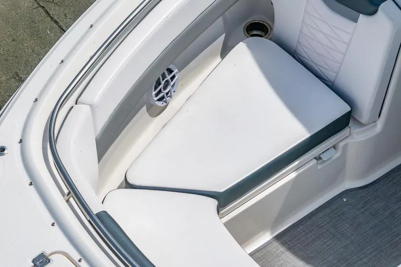 Slide: The Image of 2021 Robalo R247 Dual Console boat interior seating with speaker detail. - 13