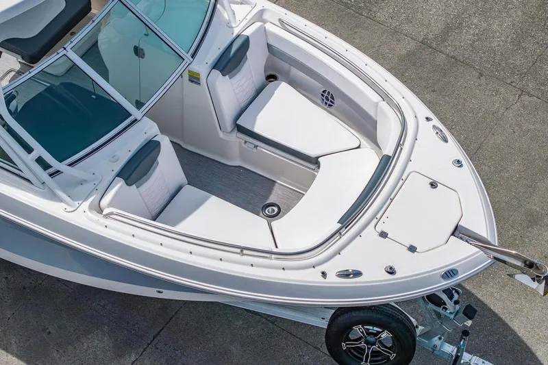 Slide: The Image of 2021 Robalo R247 Dual Console boat with spacious seating and sleek design. - 15