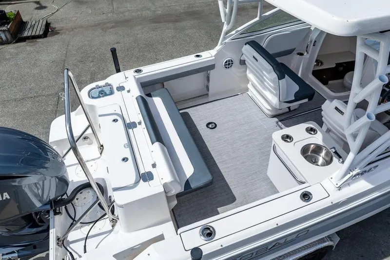 Slide: The Image of 2021 Robalo R247 Dual Console boat interior with seating and sink, viewed from above. - 5
