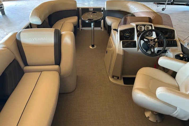 Slide: The Image of Interior of 2022 Sylvan Mirage Fish 820 Party Fish boat with plush seating and helm. - 3
