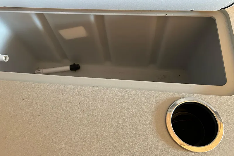 Slide: The Image of Storage compartment and cup holder on 2022 Sylvan Mirage Fish 820 Party Fish boat. - 5