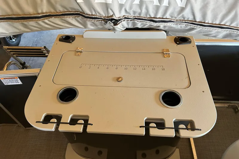 Slide: The Image of 2022 Sylvan Mirage Fish 820 Party Fish boat table with built-in cup holders and measuring guide. - 6