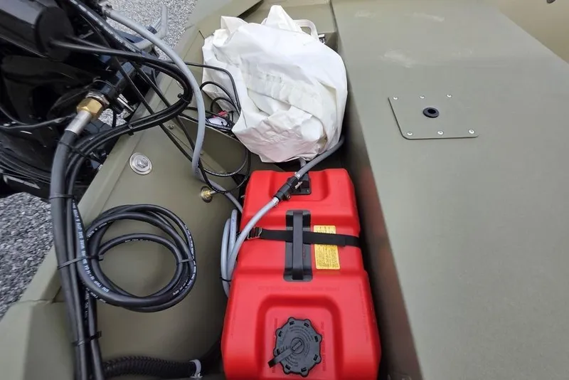 Slide: The Image of 2026 Tracker Grizzly 1648 SC boat interior with steering wheel and control panel. - 4