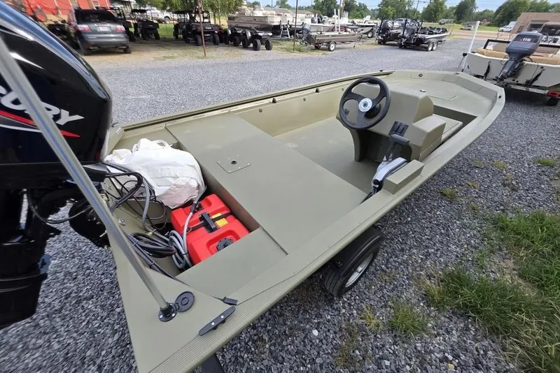 Slide: The Image of 2026 Tracker Grizzly 1648 SC boat interior with built-in storage compartment. - 6