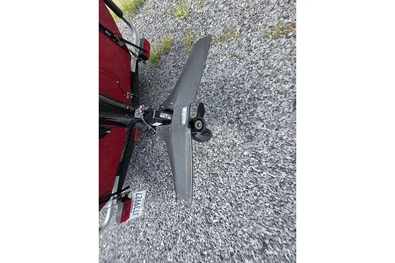 Slide: The Image of 2020 Tracker Pro 170 boat motor on gravel surface, showcasing propeller and license plate. - 10