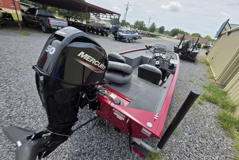 Slide: The Image of 2020 Tracker Pro 170 boat with Mercury 50 engine, parked on gravel. - 4