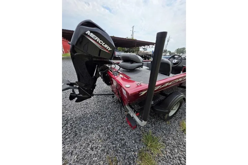 Slide: The Image of 2020 Tracker Pro 170 boat with Mercury outboard motor on gravel surface. - 8