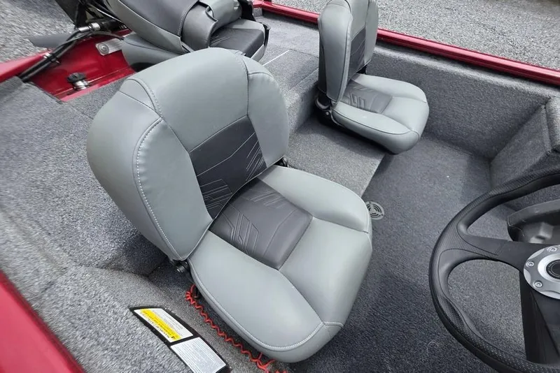 Slide: The Image of 2020 Tracker Pro 170 boat interior with gray seats and steering wheel. - 9
