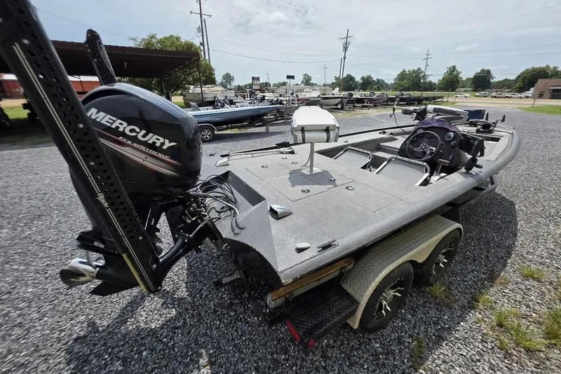 Slide: The Image of 2018 War Eagle 961 Predator boat with Mercury engine on a trailer. - 4