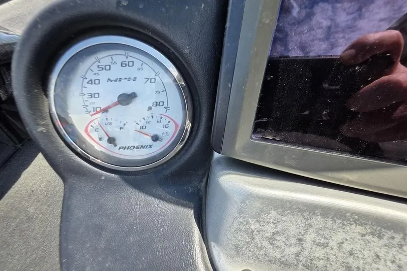 Slide: The Image of Close-up of a 2012 Phoenix 721 ProXP speedometer and fuel gauge. - 11
